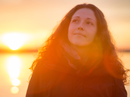 person in front of sunset | Nellie Health Online Therapy Ontario Canada US person in front of sunset | Nellie Health Online Therapy Ontario Canada US